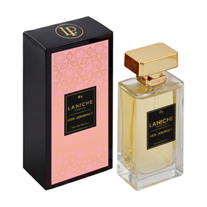 Laniche Parfum Her Journey 100ml eau de parfum, gold bottle beside a black box with an ornate gold scroll pattern on pink.
